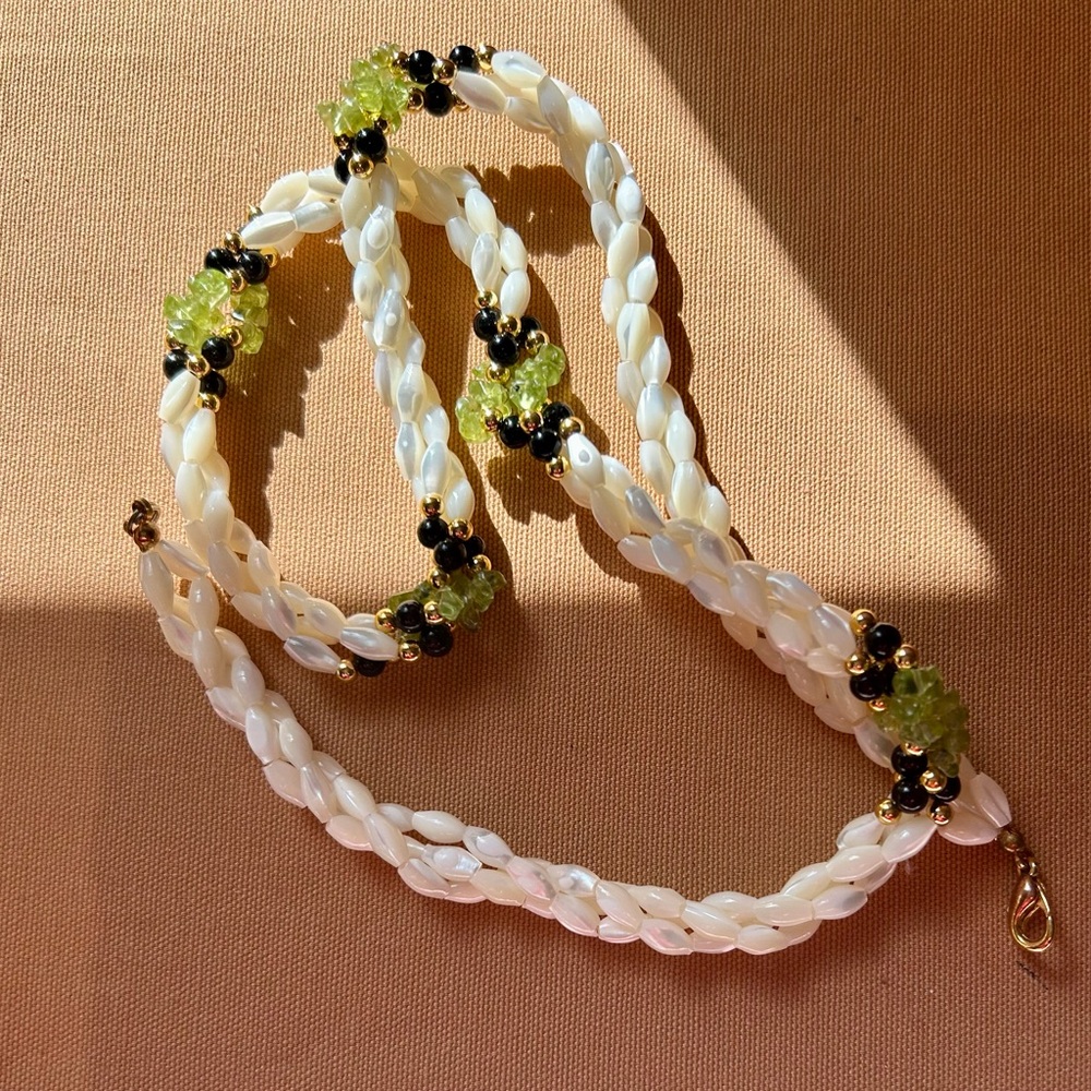 Elegant mother of pearl/peridot green stones with black and gold accent Necklace